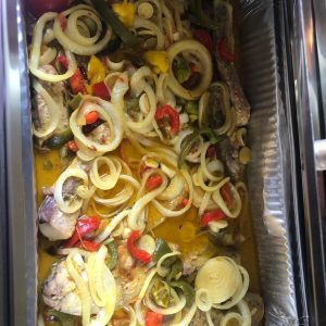 Home(live) Caribbean red snapper with onions peppers and seasoning